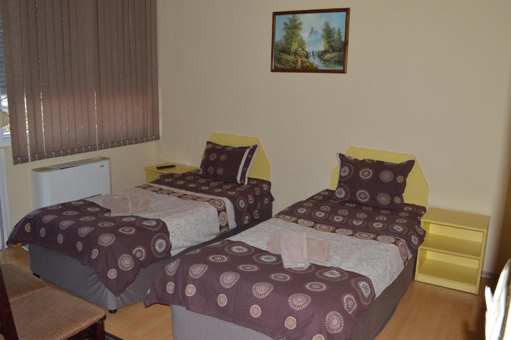 Postel nebo postele na pokoji v ubytování Dionis Hotel