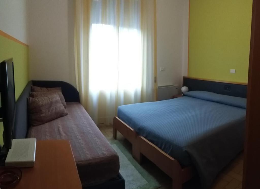 Postel nebo postele na pokoji v ubytování Hotel Bermuda