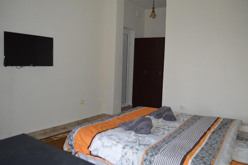 Postel nebo postele na pokoji v ubytování Dionis Hotel
