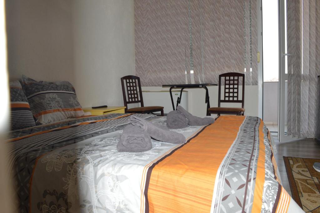 Postel nebo postele na pokoji v ubytování Dionis Hotel