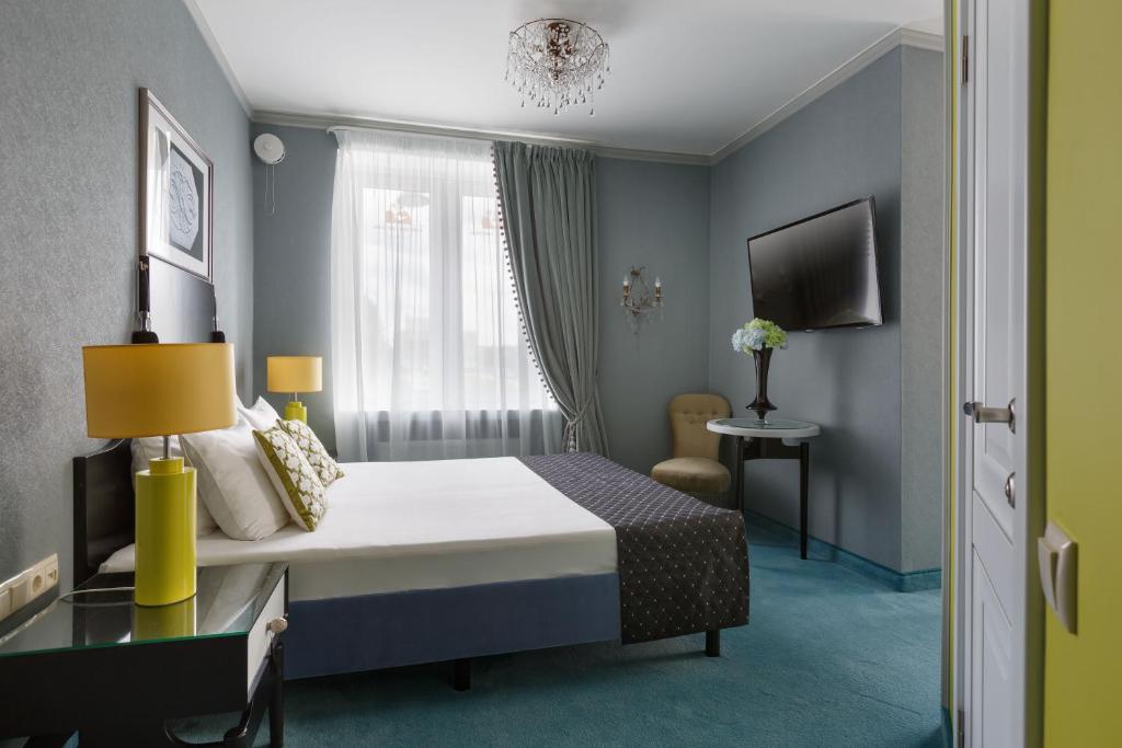 Krevet ili kreveti u jedinici u okviru objekta Statskij Sovetnik Hotel Zagorodnyy