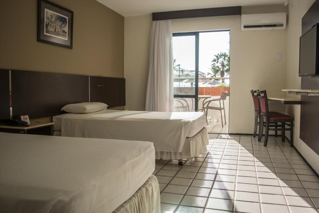 Postel nebo postele na pokoji v ubytování Brisamar Hotel & SPA São Luís