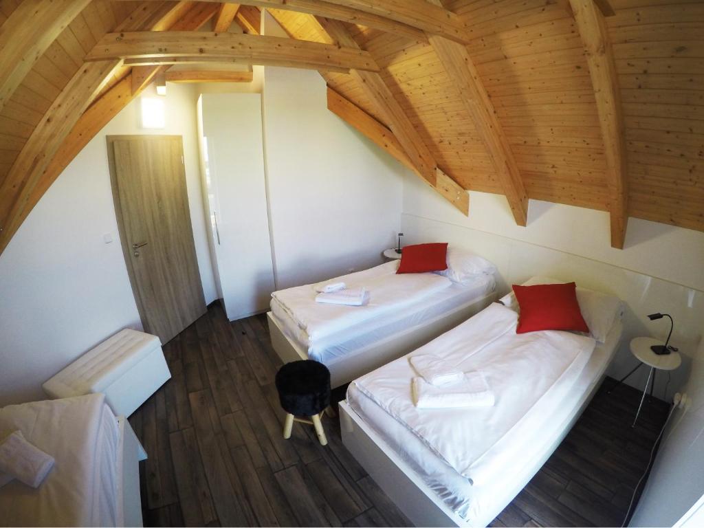 Postel nebo postele na pokoji v ubytování Apartmány ROSE Lednice