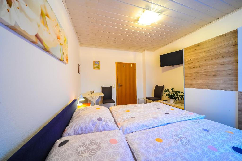 Postel nebo postele na pokoji v ubytování Privatzimmer Haus Erika