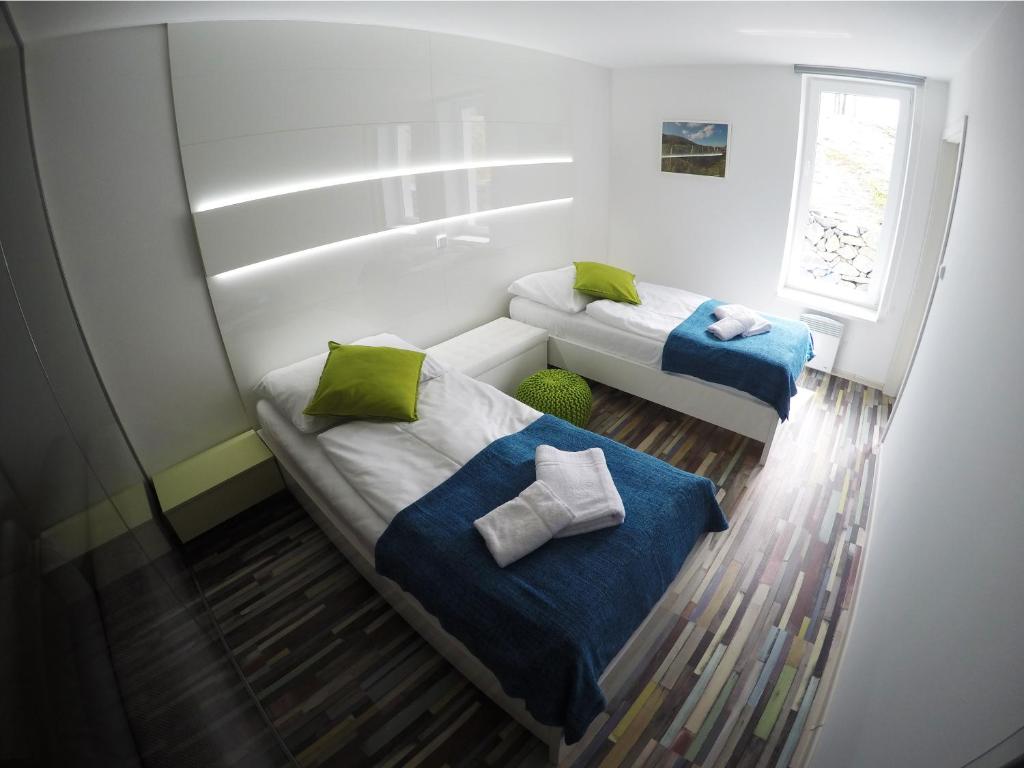Postel nebo postele na pokoji v ubytování Apartmány ROSE Lednice