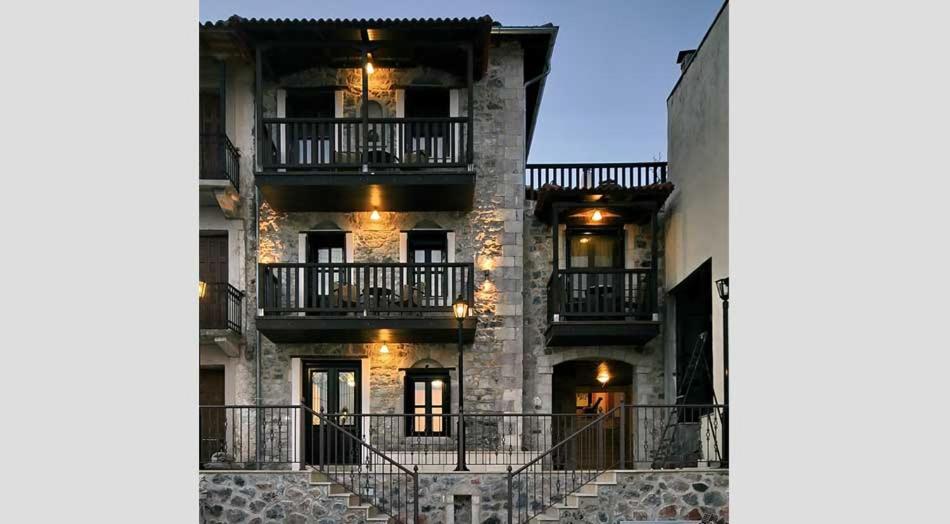 a large building with balconies on the side of it at Archontiko Parcha in Levidi
