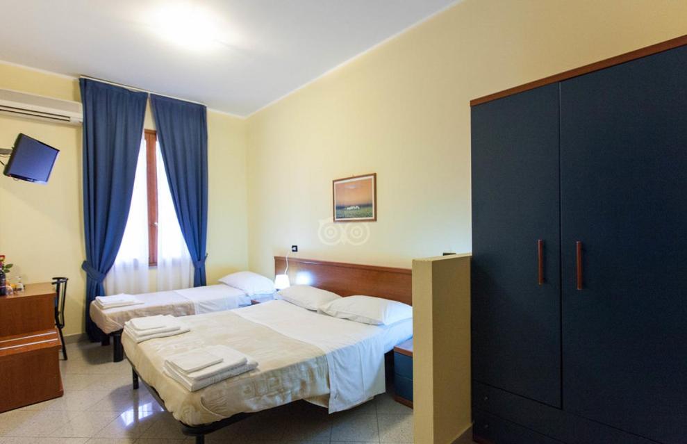 Cama o camas de una habitación en Hotel Greco