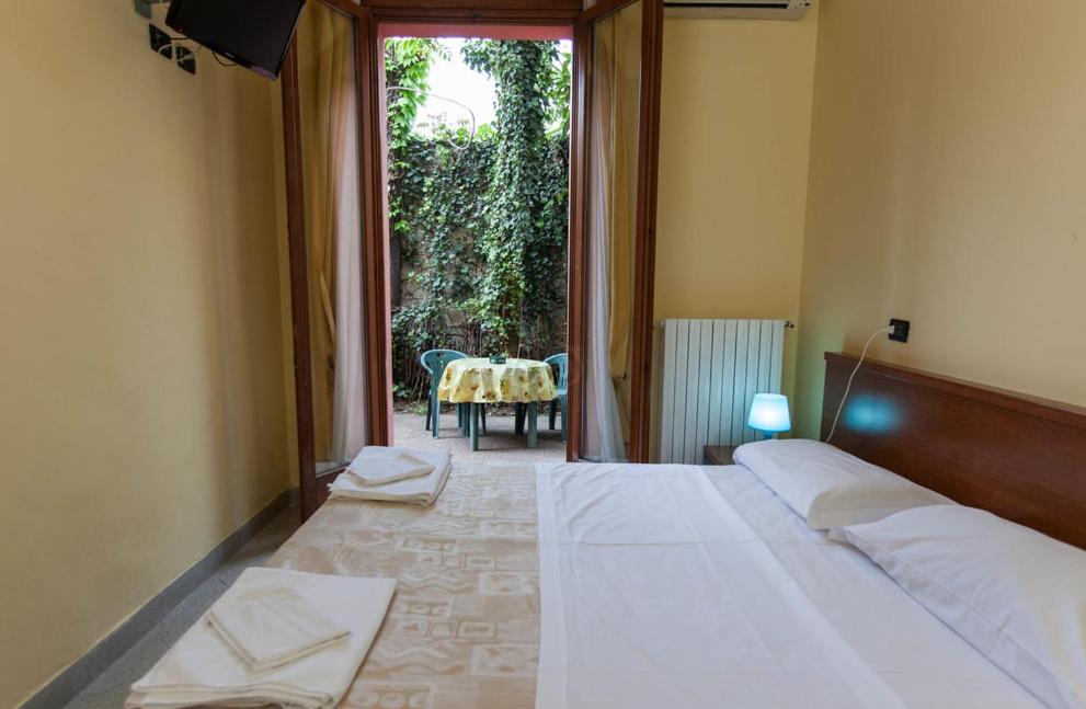 Cama o camas de una habitación en Hotel Greco