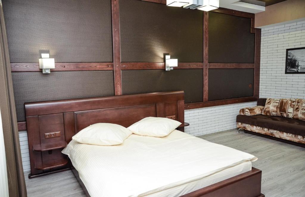 Postel nebo postele na pokoji v ubytování Nashe Misto Guest House