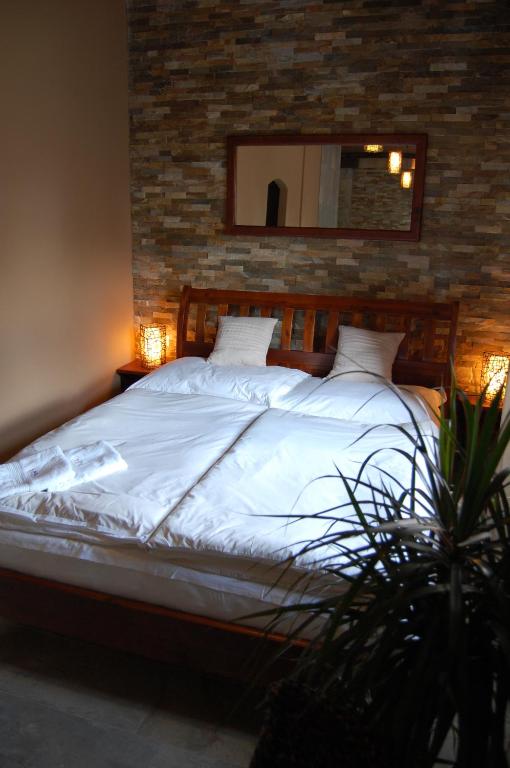 Postel nebo postele na pokoji v ubytování Hotel RICHTR