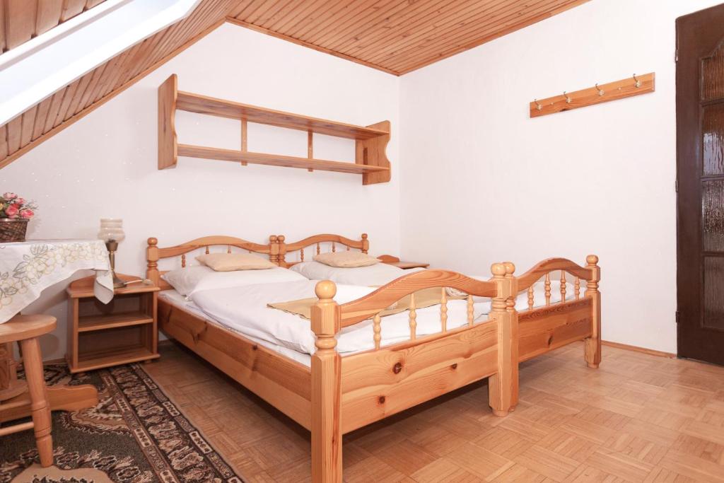 A bed or beds in a room at Privát Gallik