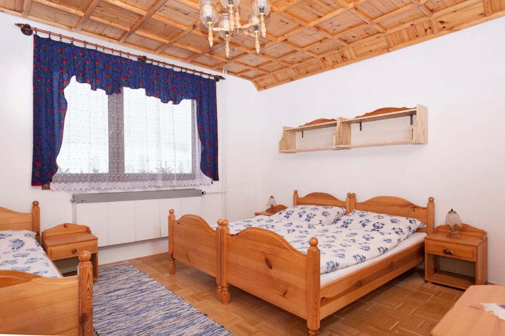 A bed or beds in a room at Privát Gallik