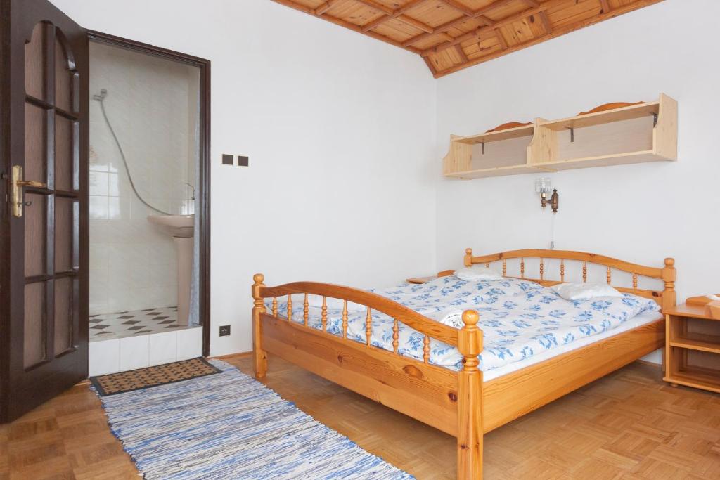 A bed or beds in a room at Privát Gallik