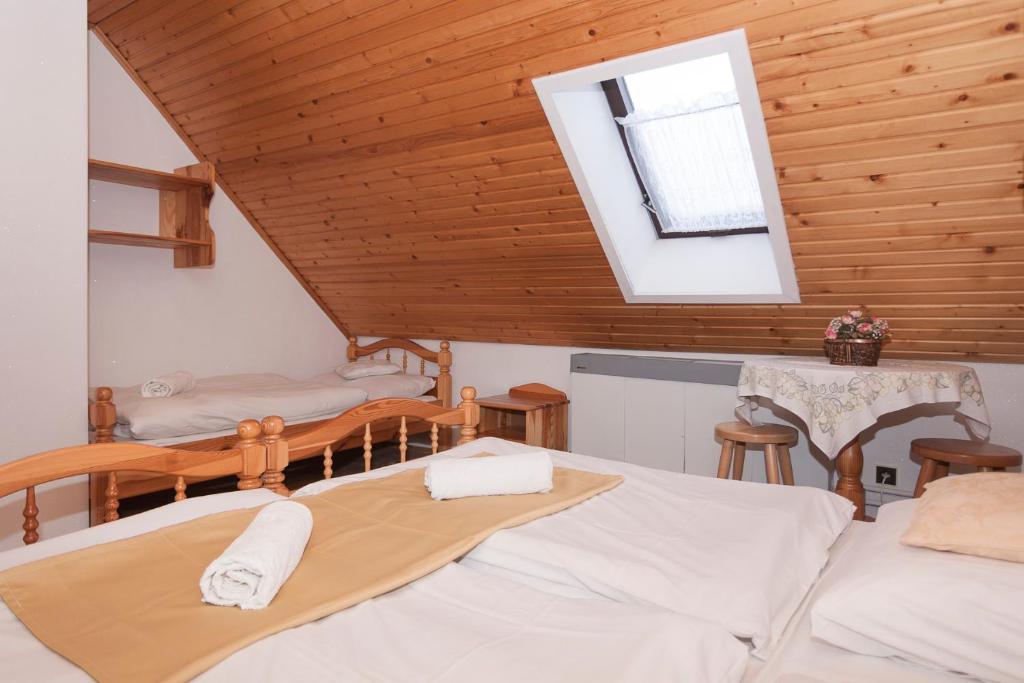 A bed or beds in a room at Privát Gallik