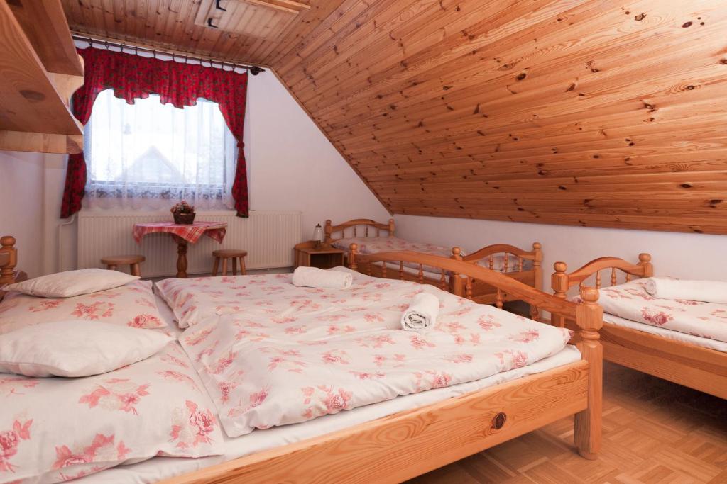 A bed or beds in a room at Privát Gallik