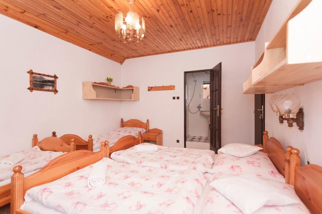 A bed or beds in a room at Privát Gallik