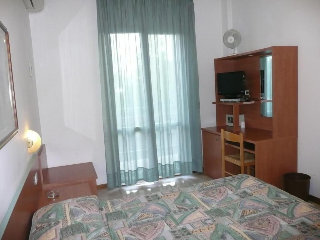 Postel nebo postele na pokoji v ubytování Hotel Darsena