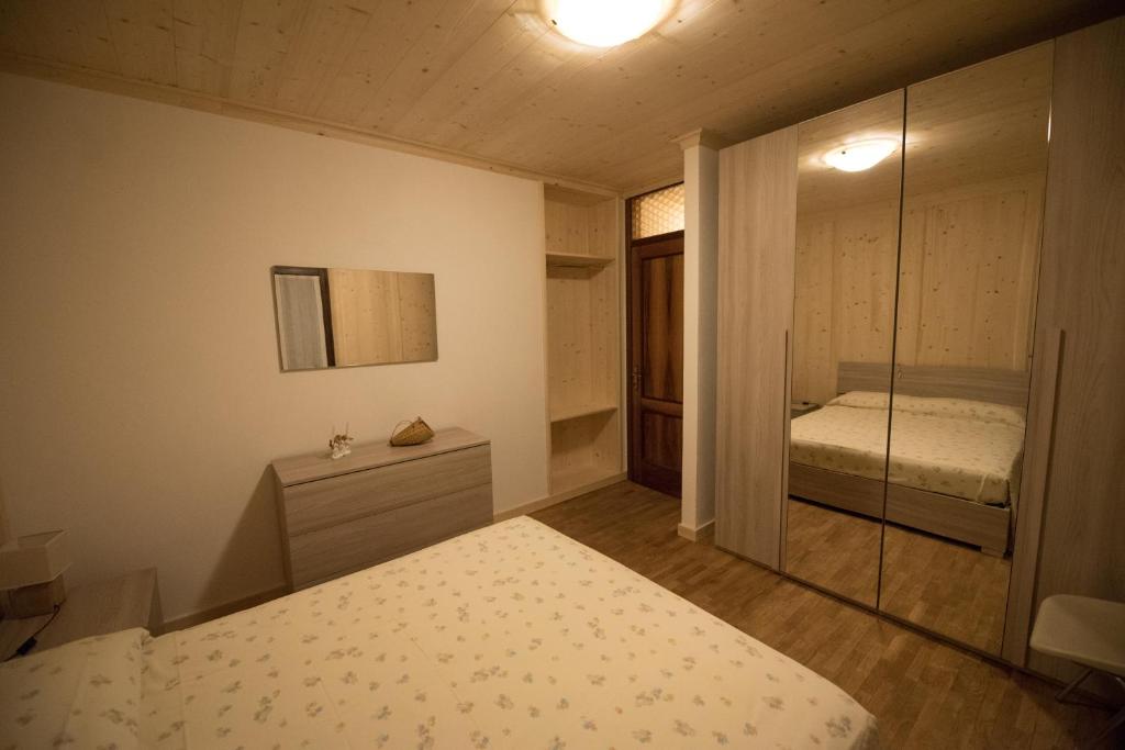 Postel nebo postele na pokoji v ubytování casa per vacanze Letizia