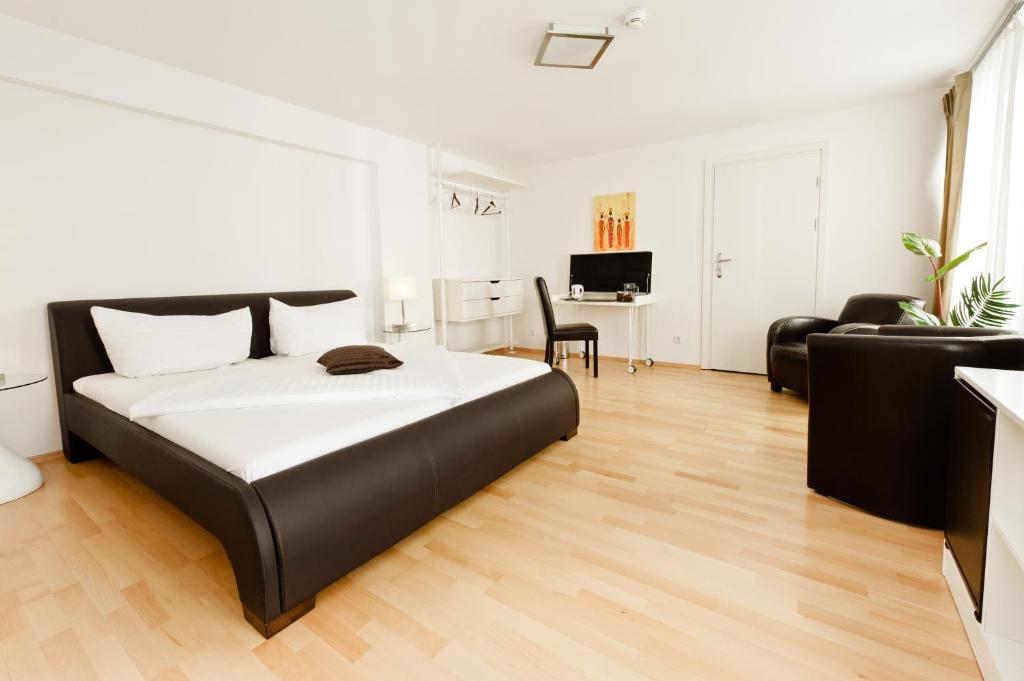 Postel nebo postele na pokoji v ubytování VOX Design Hotel