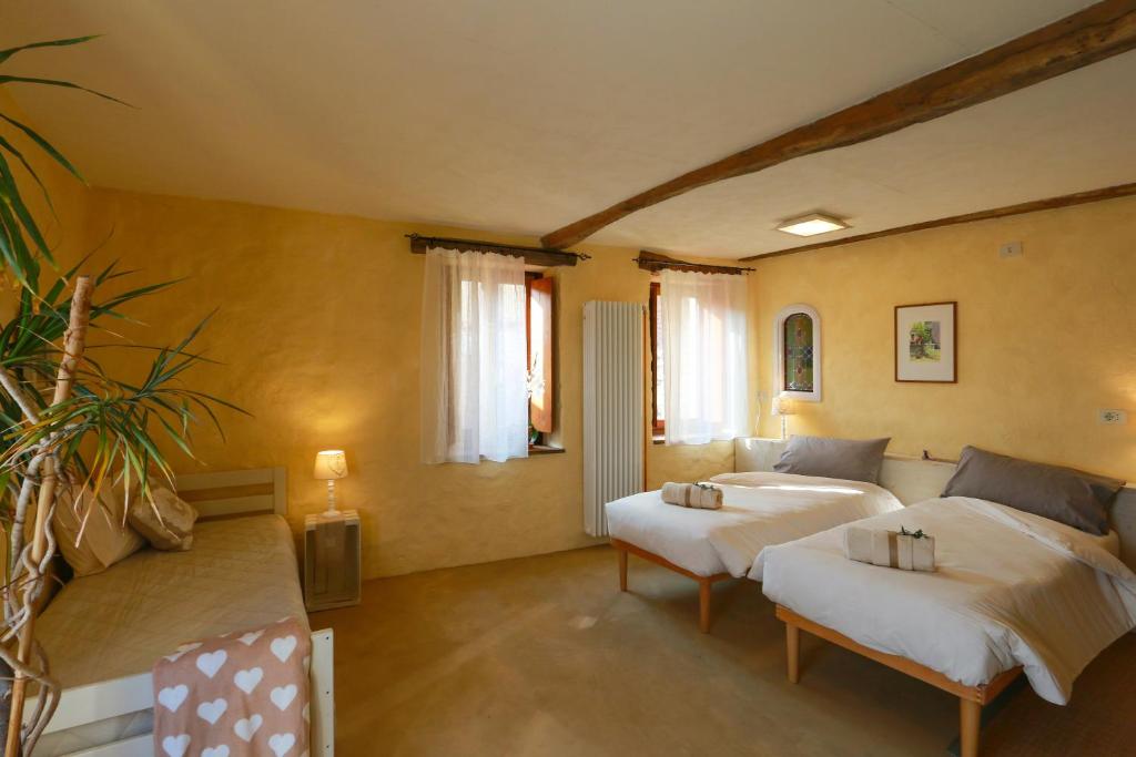 Posteľ alebo postele v izbe v ubytovaní b&b Balcone del Biellese