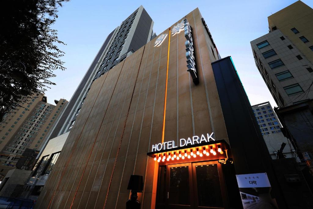 a building with a hotel drink sign on it at Darak Hotel in Seoul