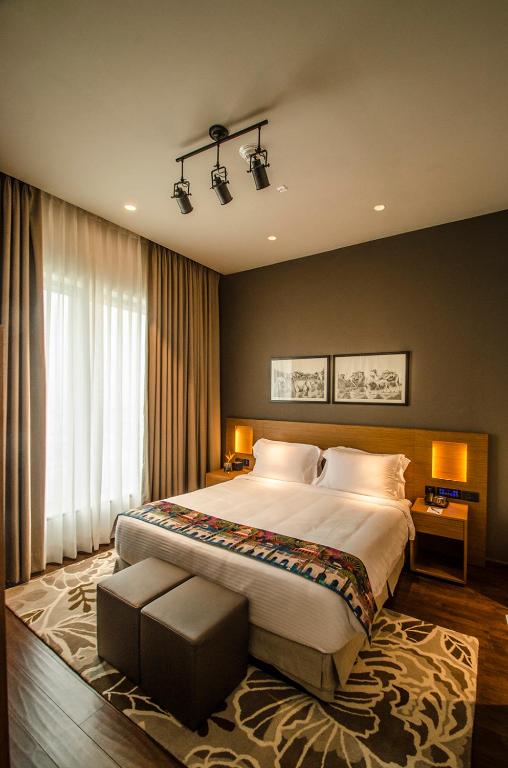 Postel nebo postele na pokoji v ubytování AltAir Boutique Hotel