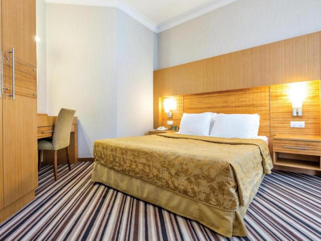 Postel nebo postele na pokoji v ubytování Grand Cettia Hotel