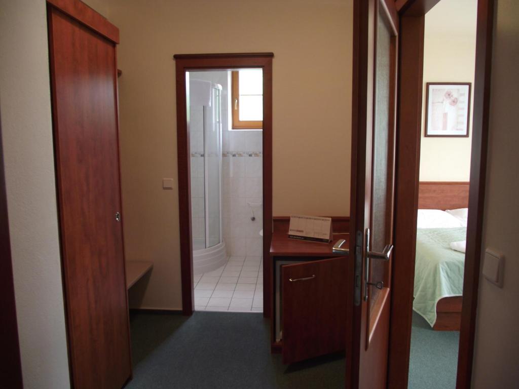 Postel nebo postele na pokoji v ubytování Hotel Praha