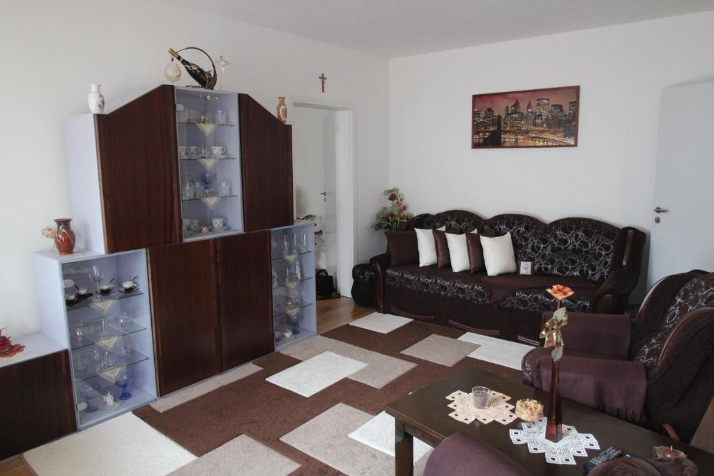 a living room with a couch and a table at Apartman Trajan in Piešťany