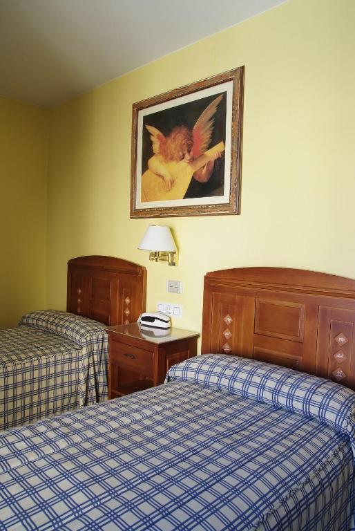 Postel nebo postele na pokoji v ubytování Hotel Restaurante Los Angeles
