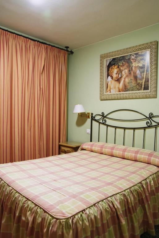 Postel nebo postele na pokoji v ubytování Hotel Restaurante Los Angeles