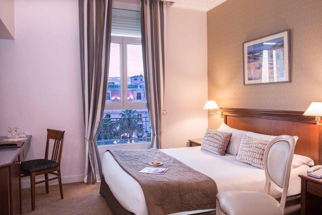 Postel nebo postele na pokoji v ubytování Hôtel West End Promenade