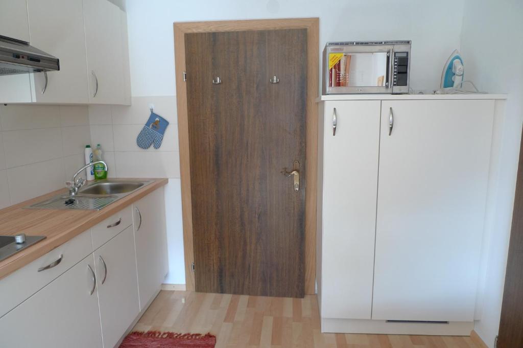 Kuchyň nebo kuchyňský kout v ubytování Single Apartment Martlerhof