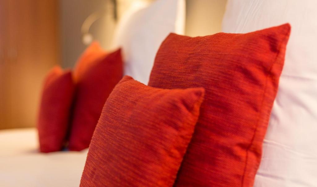 Postel nebo postele na pokoji v ubytování Hotel Royal