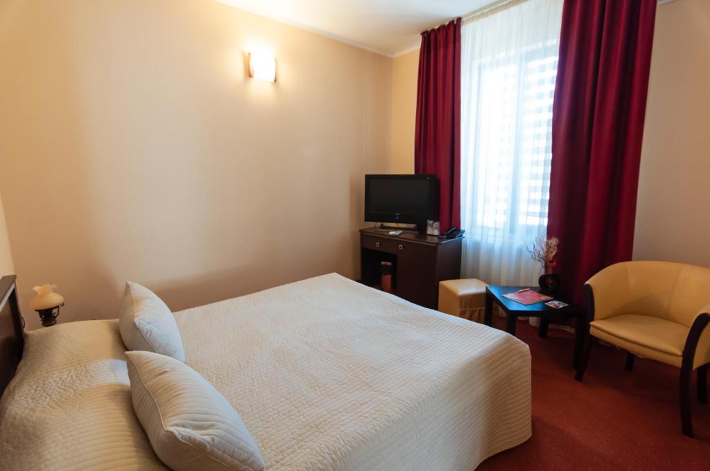 TV a/nebo společenská místnost v ubytování Hotel Magnus Galati