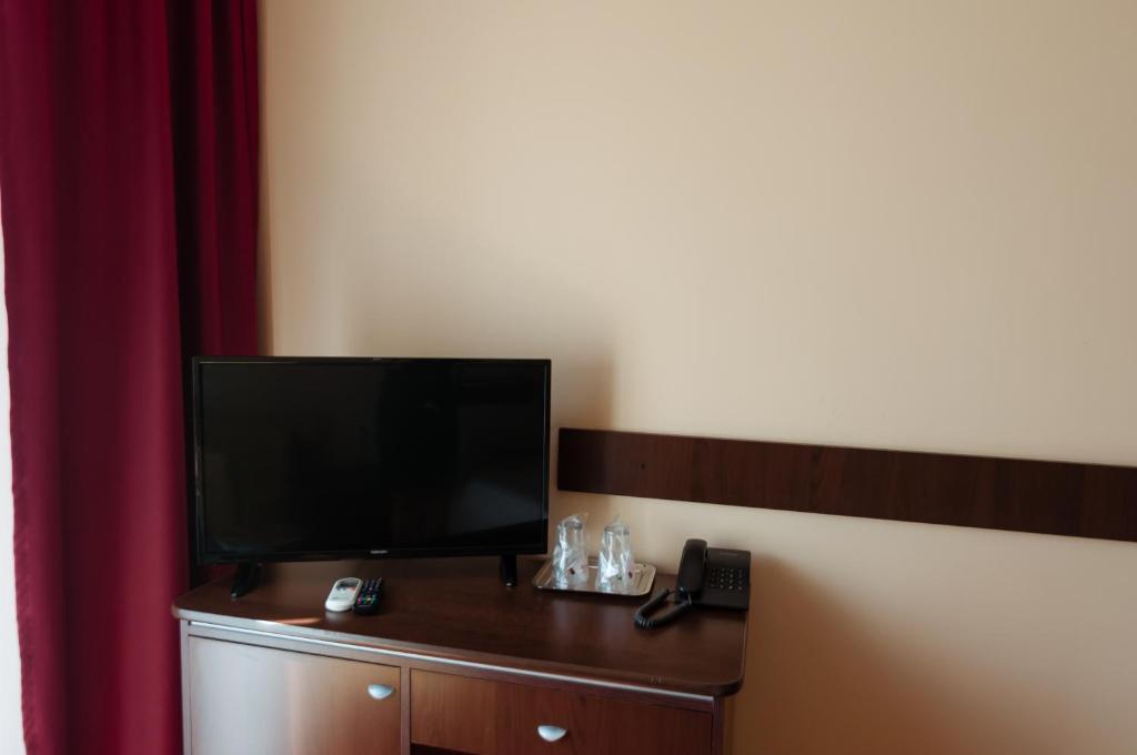 TV a/nebo společenská místnost v ubytování Hotel Magnus Galati