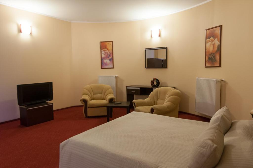 TV a/nebo společenská místnost v ubytování Hotel Magnus Galati