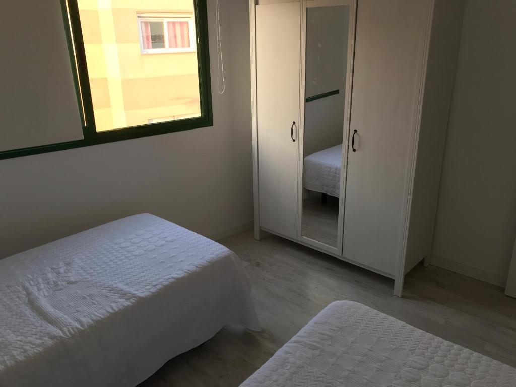 A bed or beds in a room at Habour Side II