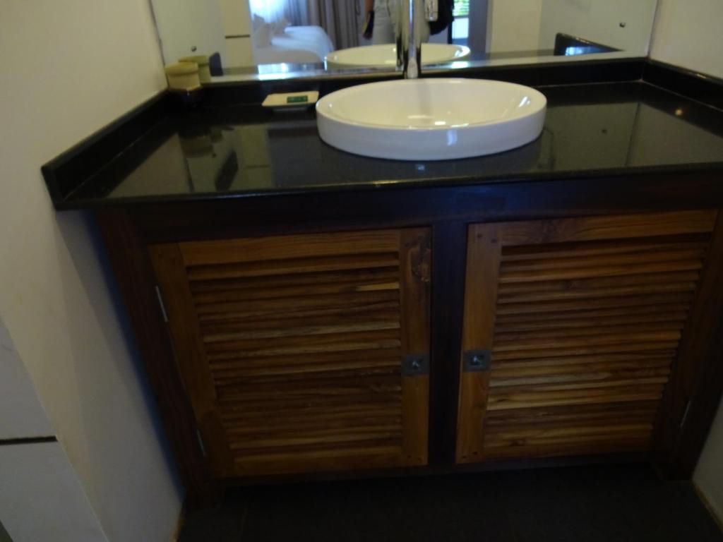 a bathroom with a sink and a counter top at Dunhill Beach Resort in Agonda