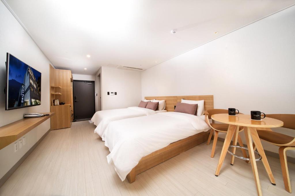 Postel nebo postele na pokoji v ubytování Pino Hotel
