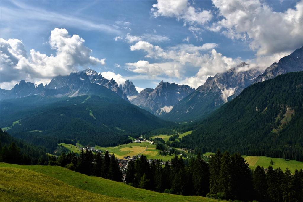 a view of a valley with mountains and trees at Kofelhof in Sesto