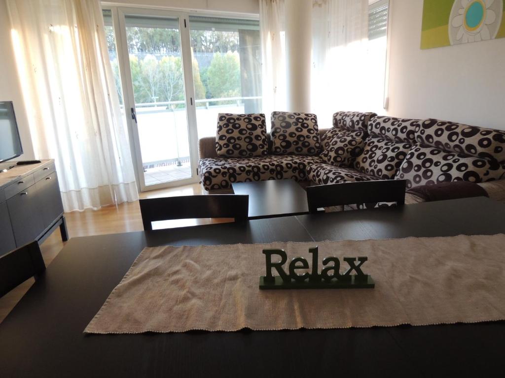 a living room with a couch and a table at SkyLinePamplona in Pamplona