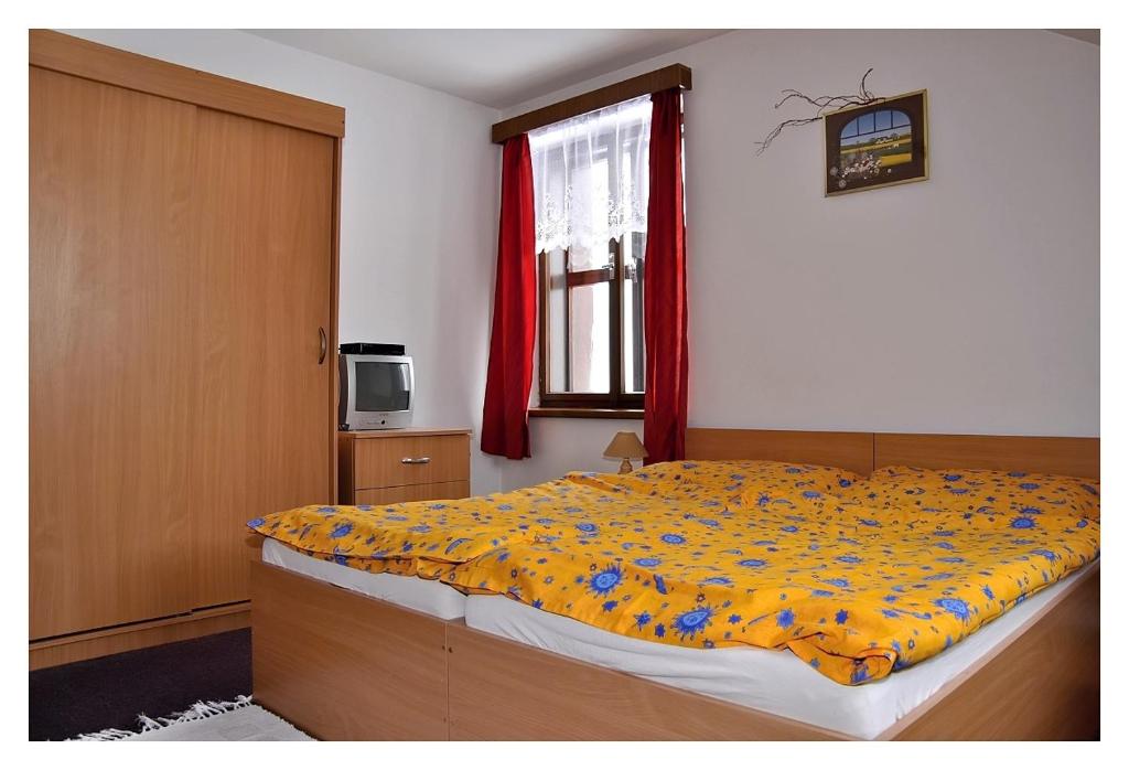Postel nebo postele na pokoji v ubytování Penzion Severák