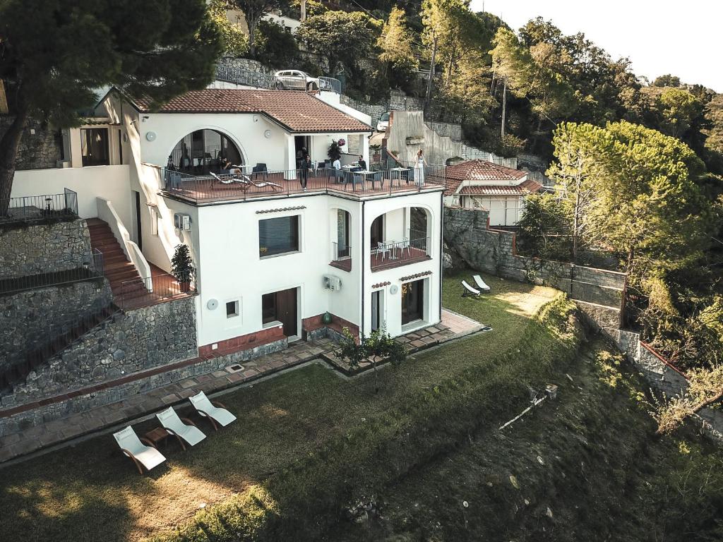 an aerial view of a white house on a hill at Villa Crawford in San Nicola Arcella