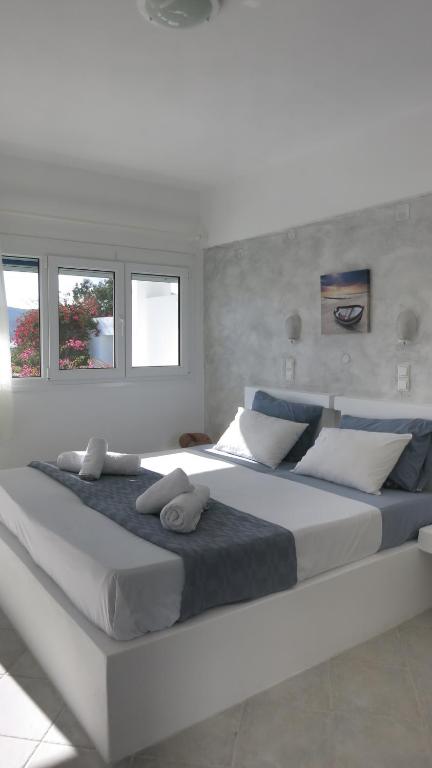 Postel nebo postele na pokoji v ubytování Lagada Beach Hotel