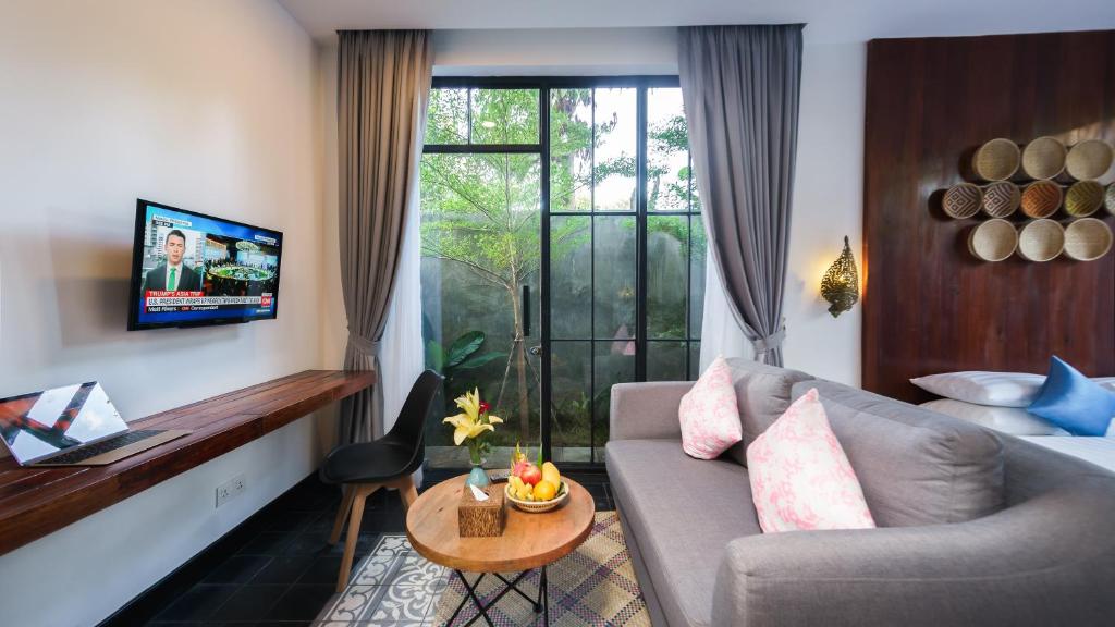 a living room with a couch and a table at Vihara The City of Temples in Siem Reap