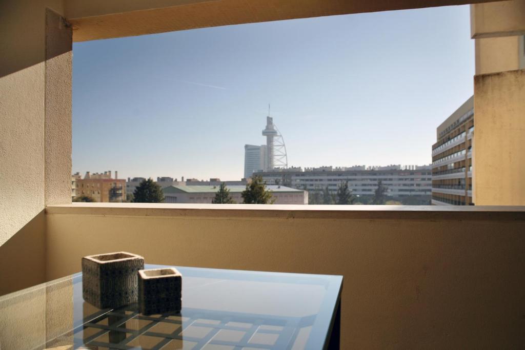 a window with a view of a city at Parque das Nações - Fil New Apartment in Lisbon