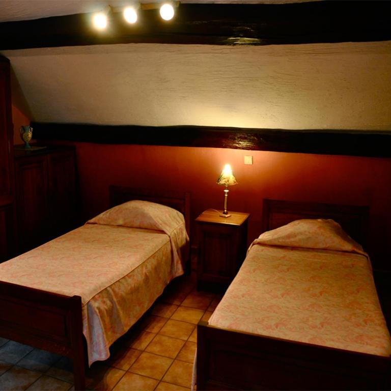 Postel nebo postele na pokoji v ubytování Hotel IL Castellino