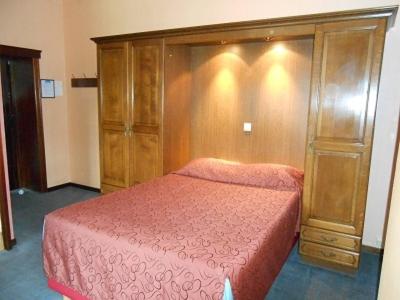 Postel nebo postele na pokoji v ubytování Hotel IL Castellino