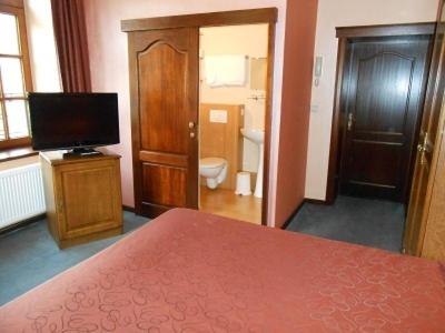 Postel nebo postele na pokoji v ubytování Hotel IL Castellino